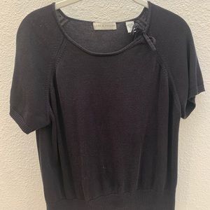 Short sleeve silk blend sweater with neck detail.